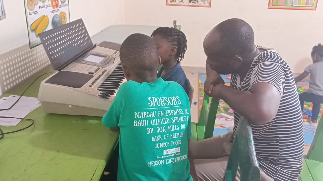 Students learning piano with an instructor