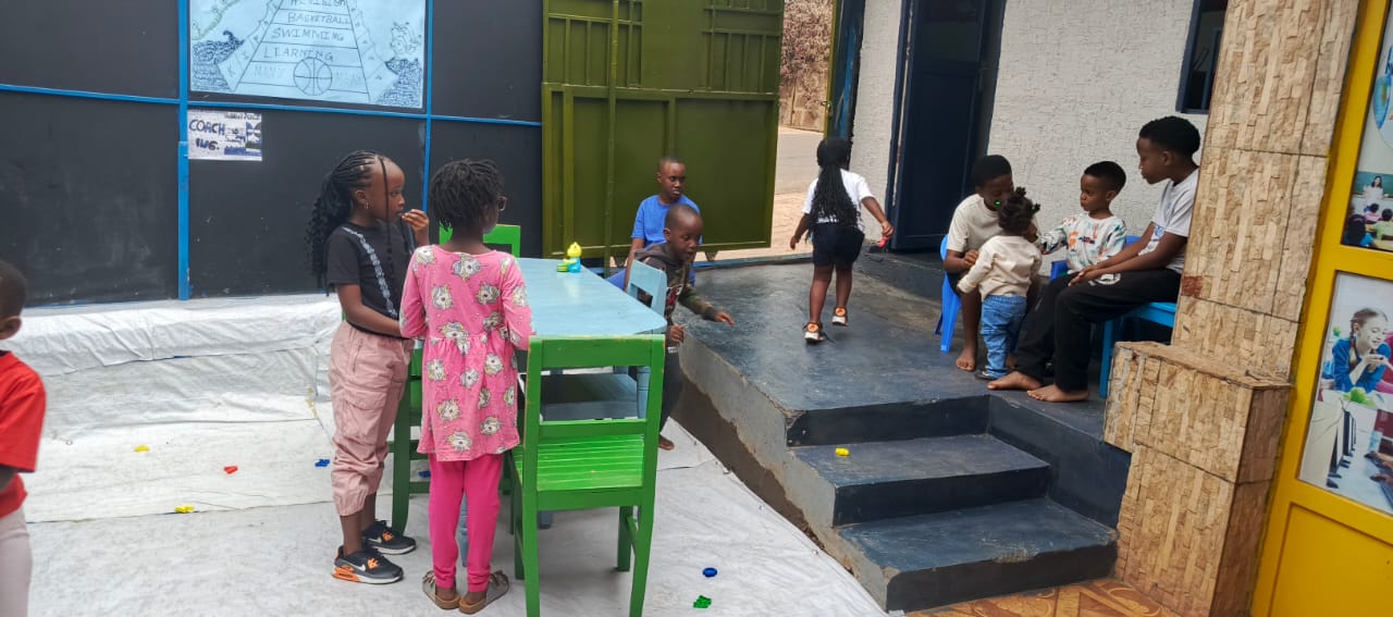 Children playing together in the KRC courtyard